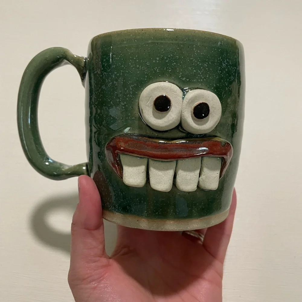 Good earth garden center mug with crazy face
